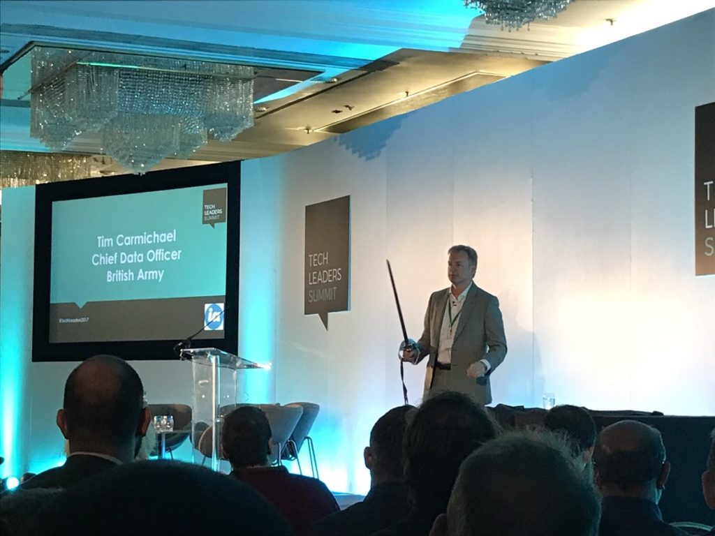 Tim Carmichael, Chief Data Officer of The British Army addressing the audience at Tech Leaders Summit in his keynote speech - with his sword